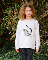 Girl wearing Unisex Organic Cotton Sweatshirt in Black and White Lemur Print