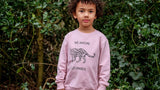 Boy wearing pink unisex organic cotton kid's sweatshirt with leopard animal print