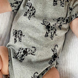 Close up of grey organic cotton baby bodysuit with elephant animal print