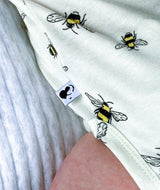 Close up shot of bee animal pattern on eco-friendly baby bodysuit