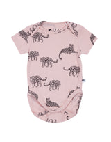 Flatlay of salmon pink unisex organic cotton sleepsuit with leopard animal print