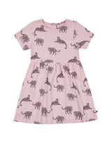 Flatlay of salmon pink organic cotton kid's dress with leopard animal print
