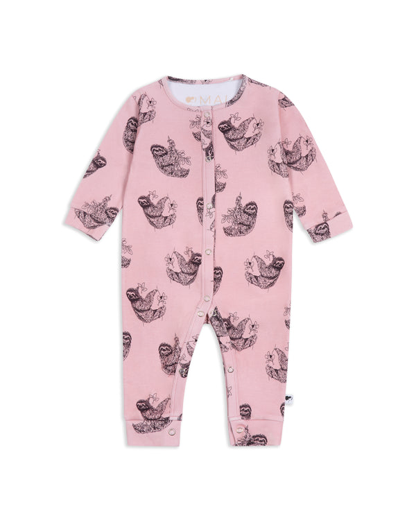 Flat lay of pink organic cotton sloth print baby romper showing full design and popper fastening