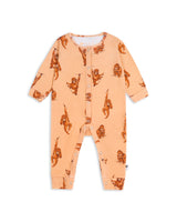 Flat lay of organic cotton orangutan romper for babies, showing full print and snap fastenings on a white background